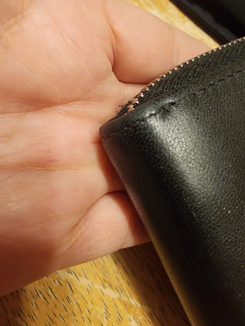 Chanel Timeless CC zip-around wallet features smooth black leather